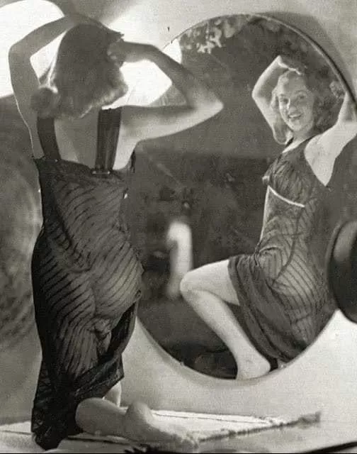 Norma Jeane Mortenson in front of a mirror, 1947. Photo by Earl Moran posted by Quick_Presentation11