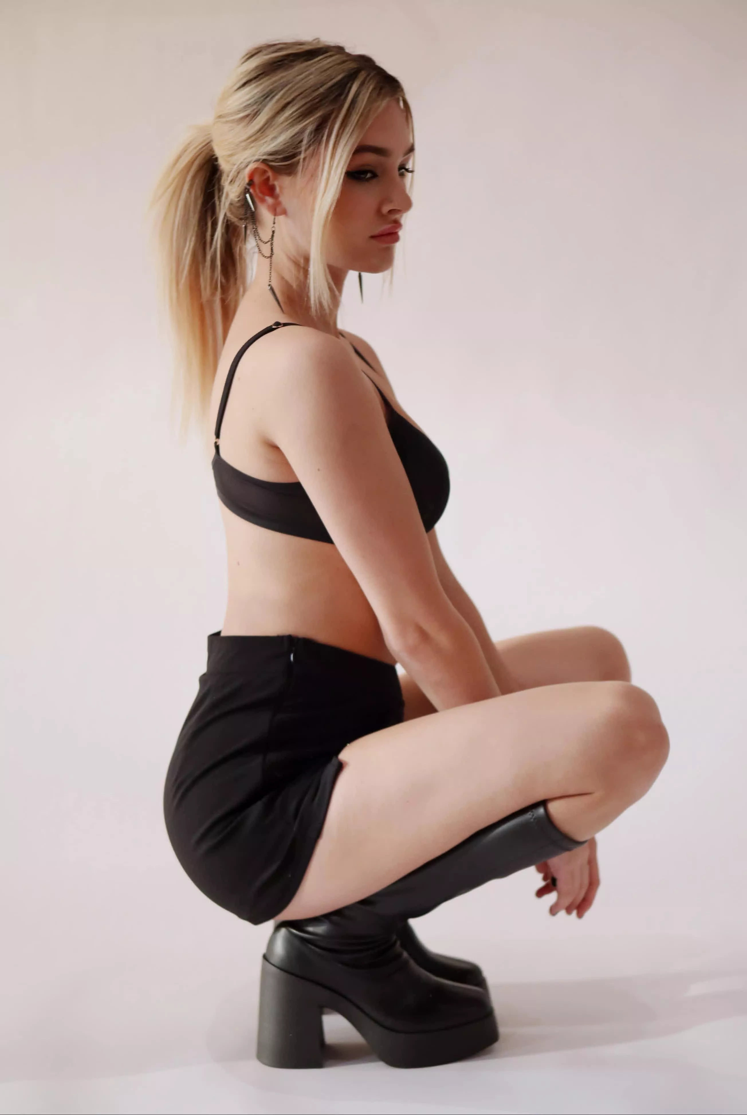 Badass blonde chick in her fave boots posted by Realistic_Message479