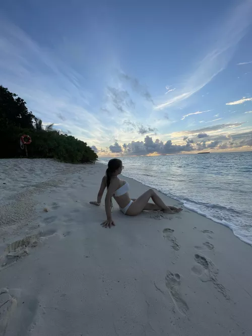 Lying on an empty beach in just a swimsuit by adlenaline_
