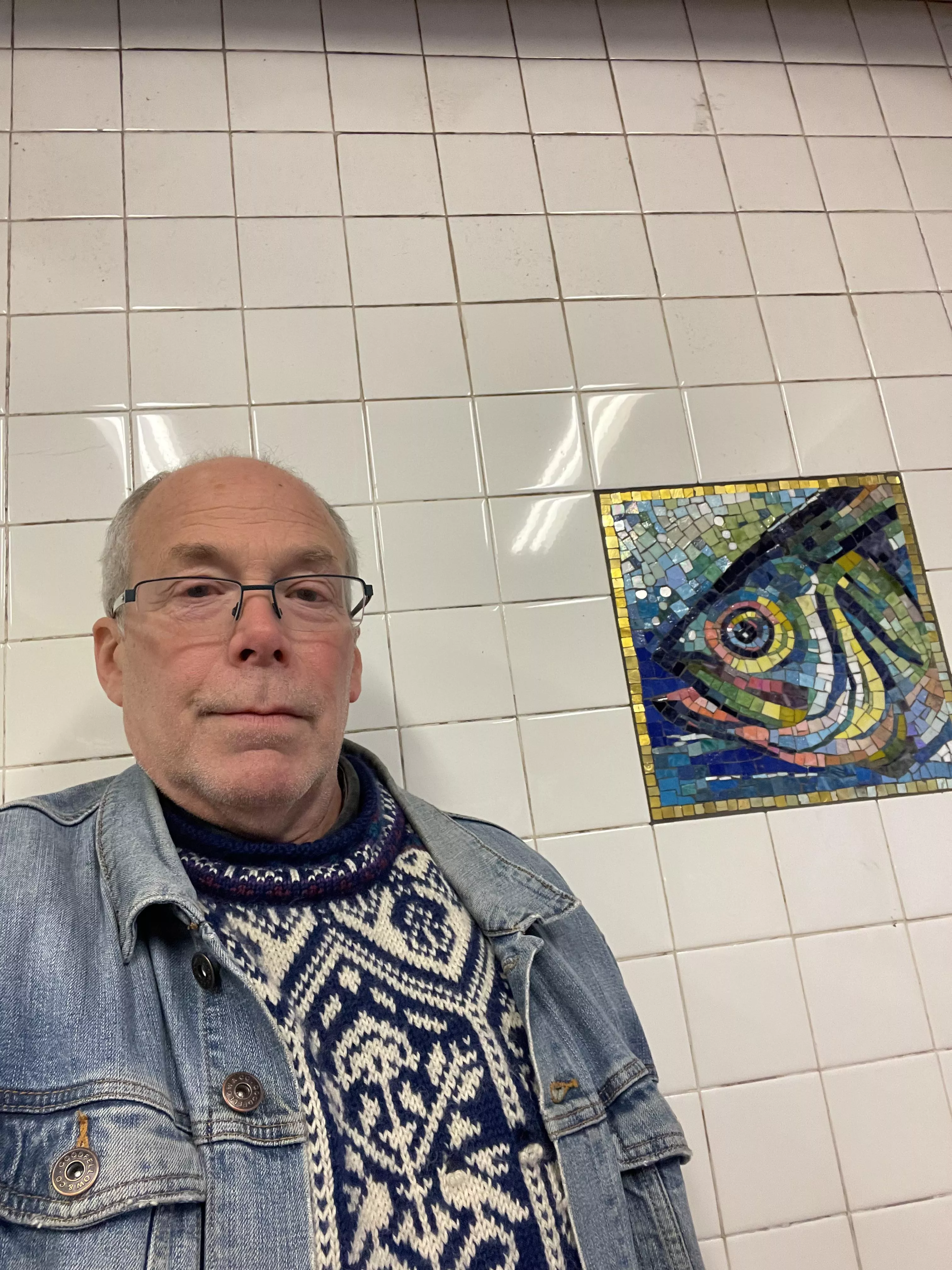 Standing next to a mosaic in the subway. posted by Reading-Writer-