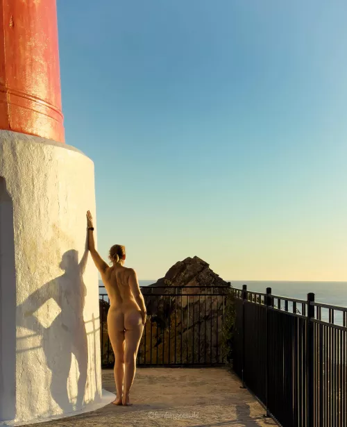 The lighthouse and me in the evening sun (self portrait) by Fernfairygoeswild