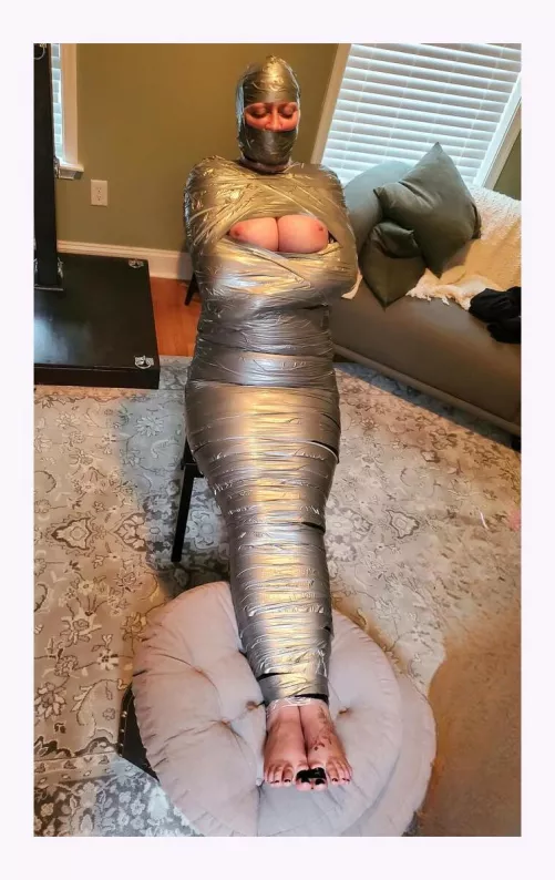 What do you do when her flight is delayed because of snow...how about a nice tight mummification? by KatelynHenderson0217