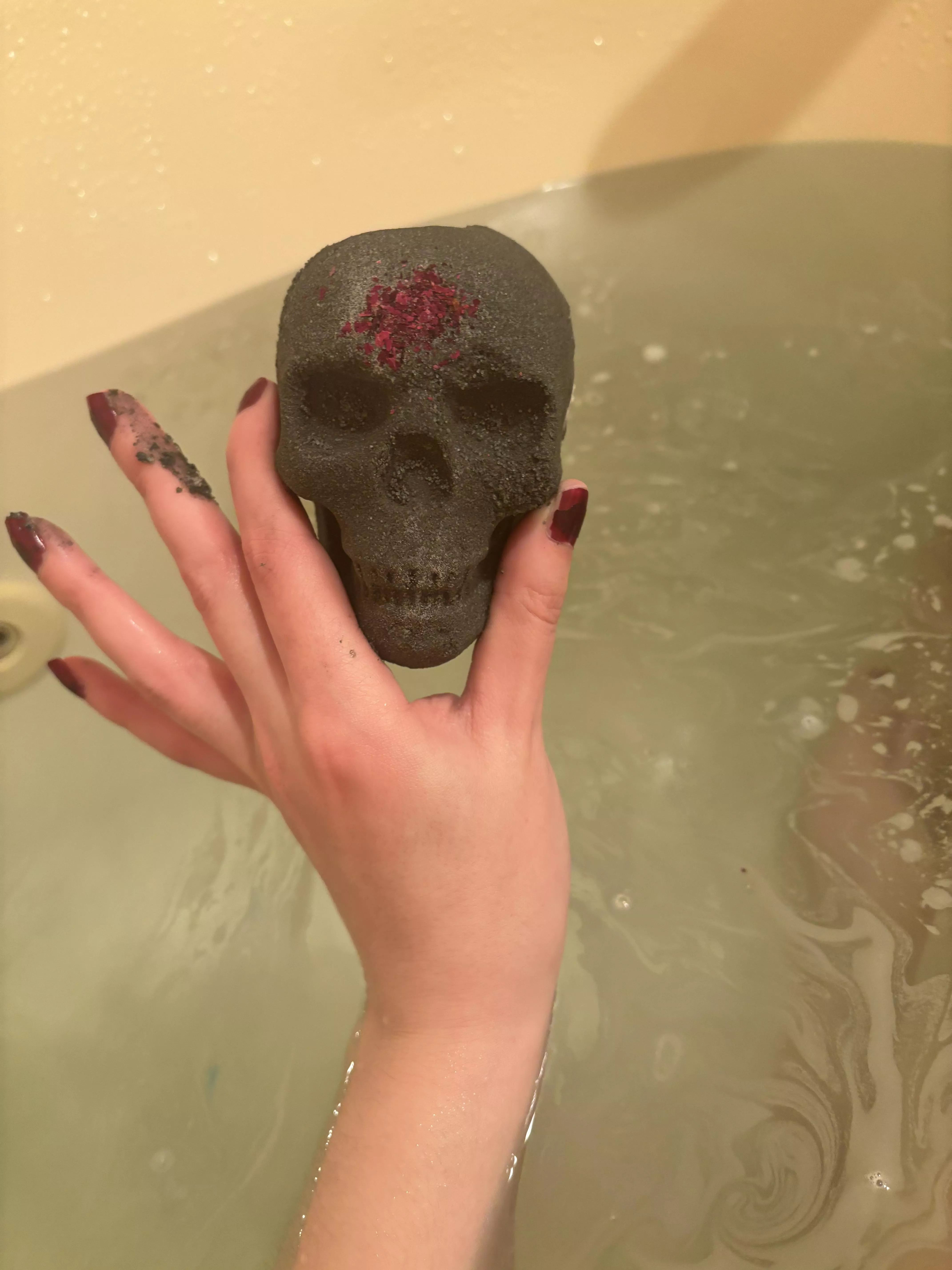 Hands on a bath bomb posted by sirenskiss3