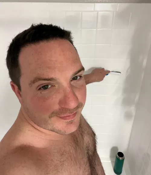 Puppy grout-brushes the shower by Snackzillas