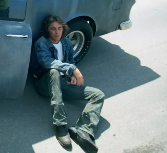 Can somebody ID this model of boot from Two-Lane Blacktop? Looks neat. Kinda like a roper, but not sure it is. by smellthepotatoes