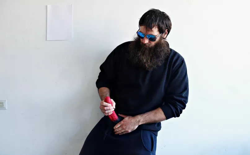 Me, with a large red dildo, while I am wearing sunglasses by Mysterious-Man1