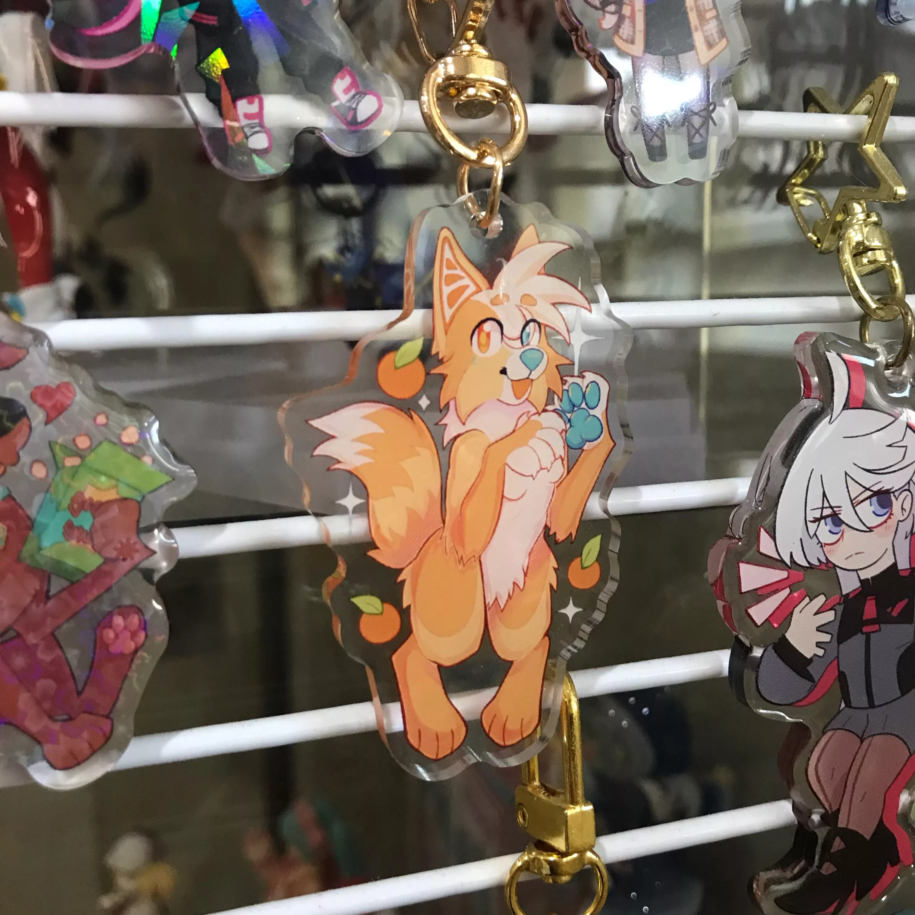 i got an acrylic charm of my fursona! 🍊 posted by liiontai