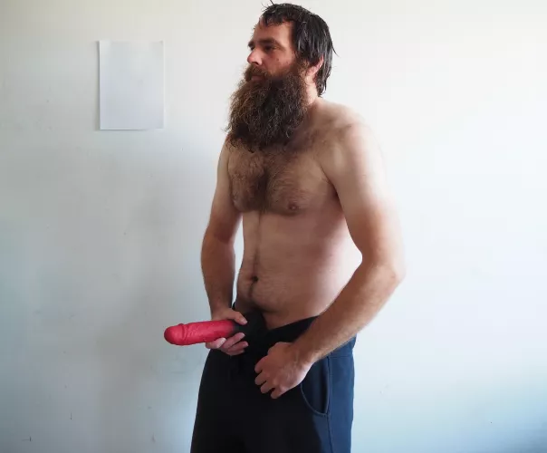 Bearded and barechest man with a 10,5 inch red dildo by Mysterious-Man1