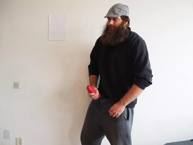 Me, while a large red dildo sticks out of my pants by Mysterious-Man1