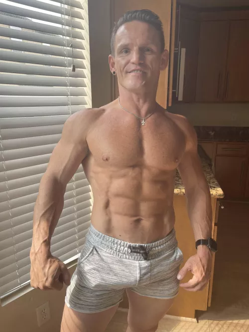 Muscles flexed and veins popping after workout. by gayvittles