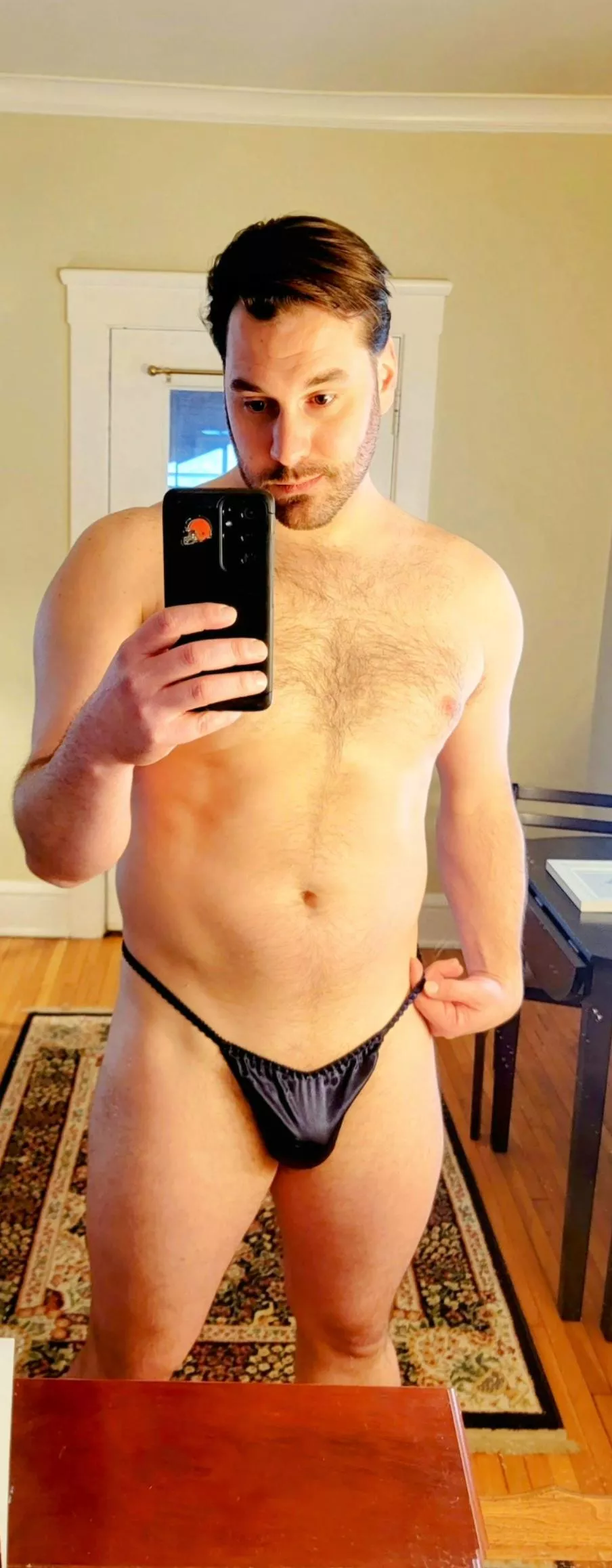 Satin midnight blue thong only. How hot it'd be to wear only this while guests are over. 😉😊 posted by Ecstatic_Cap_6914