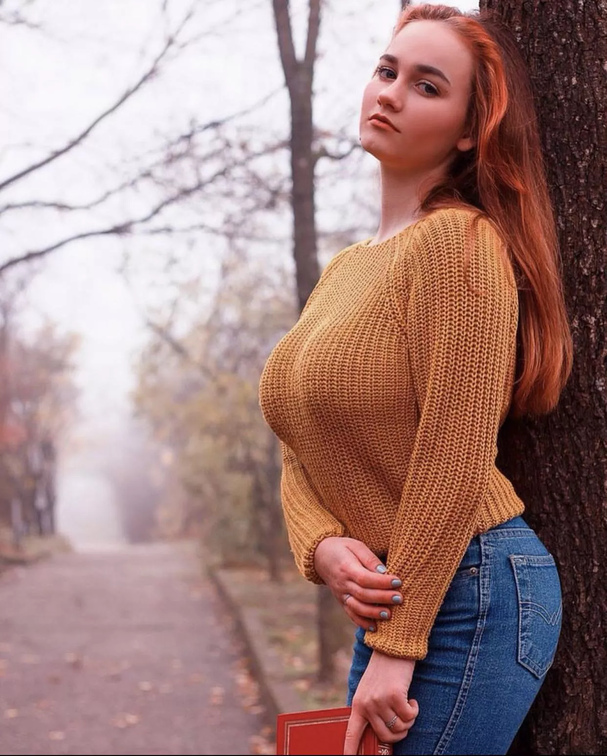 Redhead in her sweater posted by Protonomicon