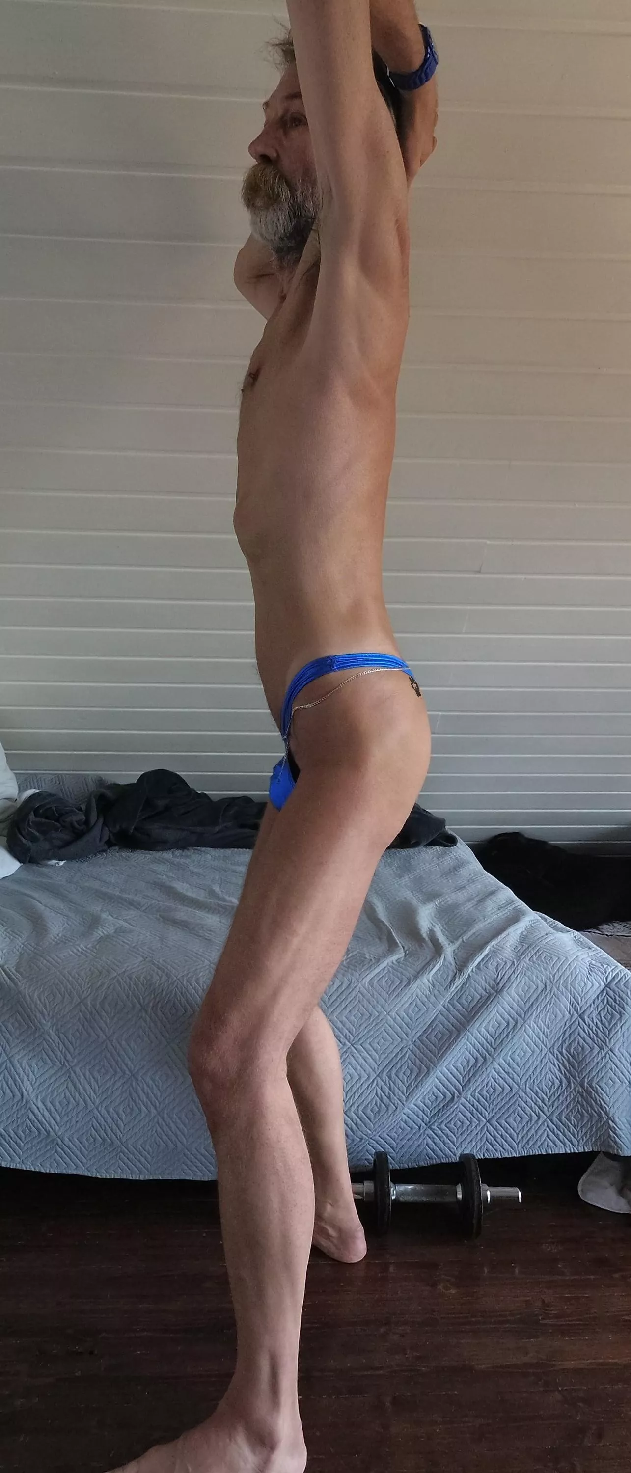 Presenting my super slim body only dressed with a blue metallic thong posted by pit_et