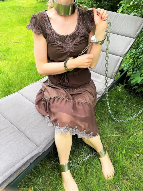 Fully chained in the garden (I might get some wierd tanlines from this...) by JessicaShackled