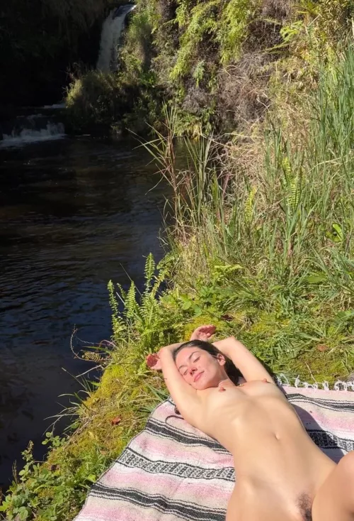 Enjoying the day by a waterfall by bellatrixortreat