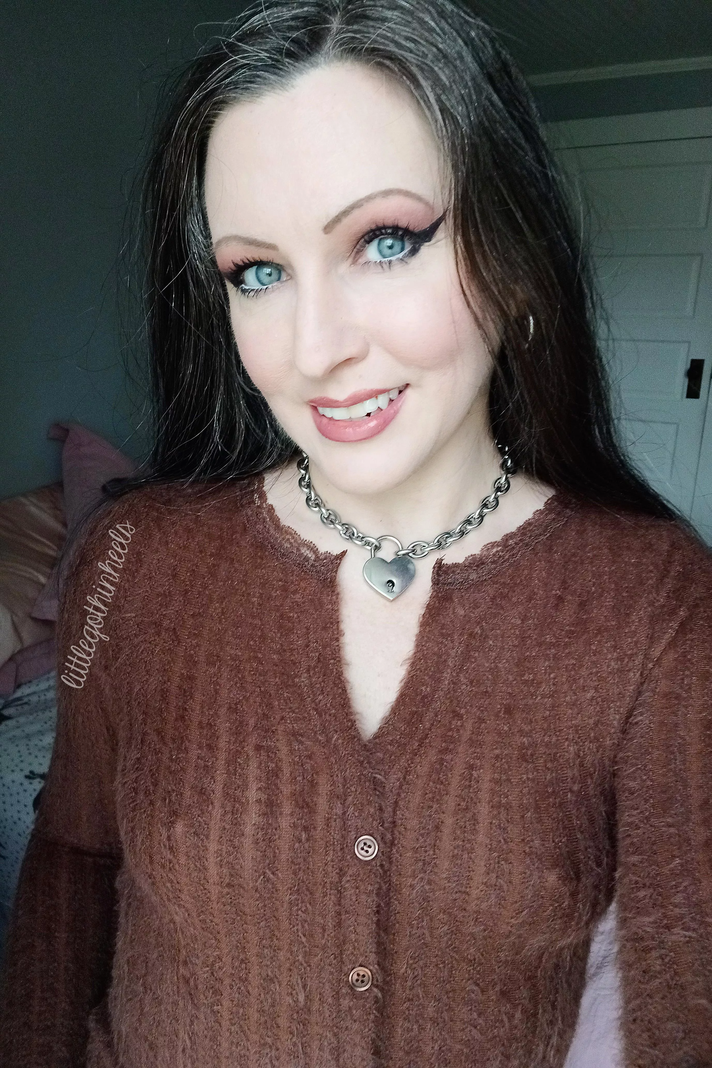 showing even through a sweater posted by littlegothinheels