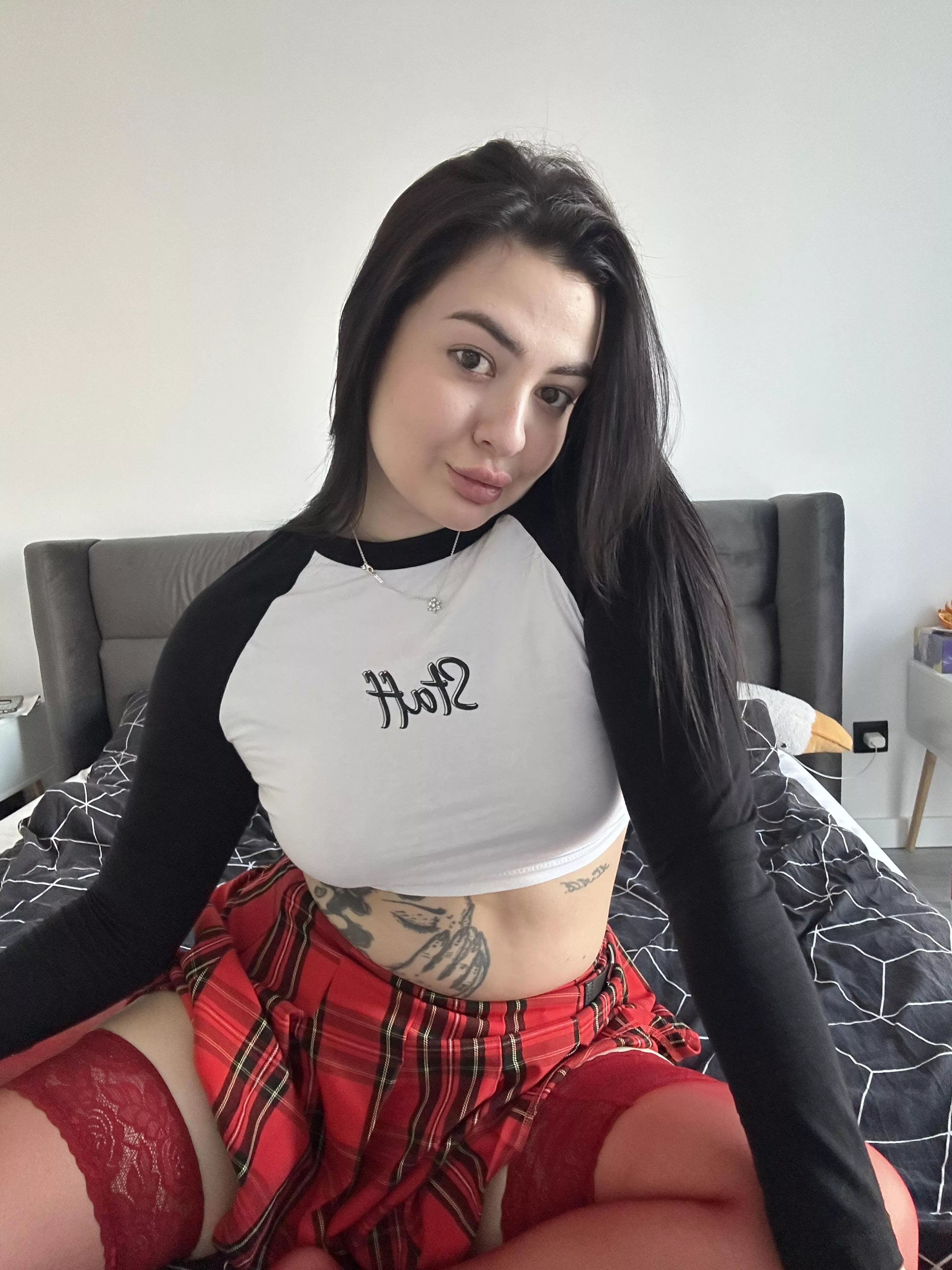 A brunette babe in a plaid skirt posted by NikkiViki