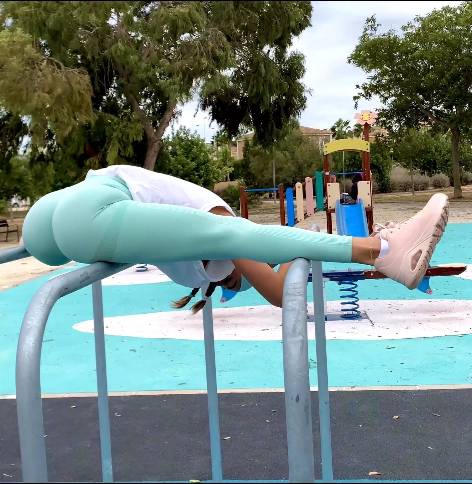 Stretching on the uneven bars posted by ms_twine_grace
