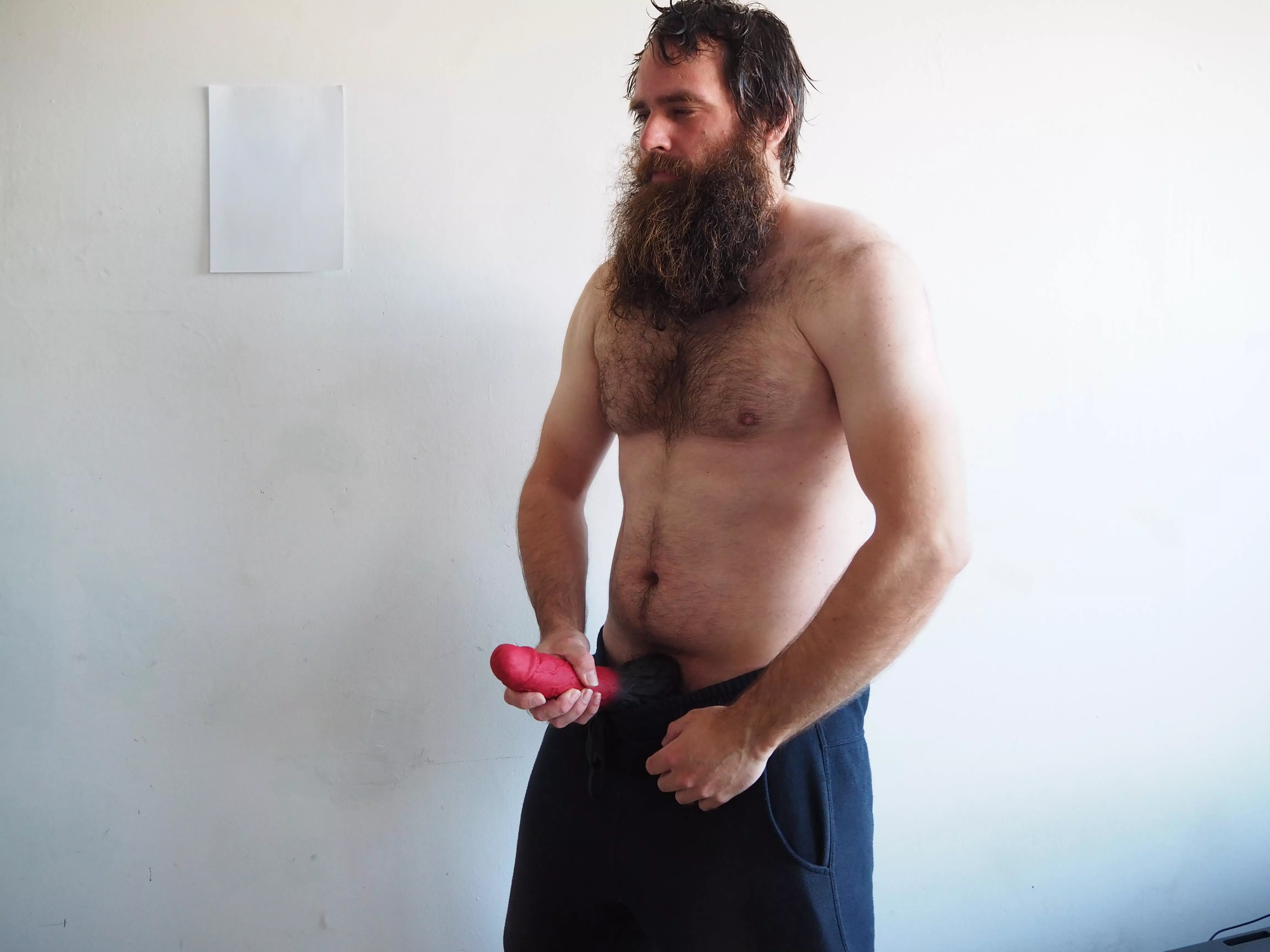 Me, while I'm holding a big red dildo in front of me posted by Mysterious-Man1