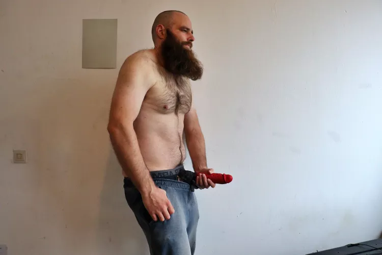 Me, while I'm holding a large red dildo in front of me by Mysterious-Man1
