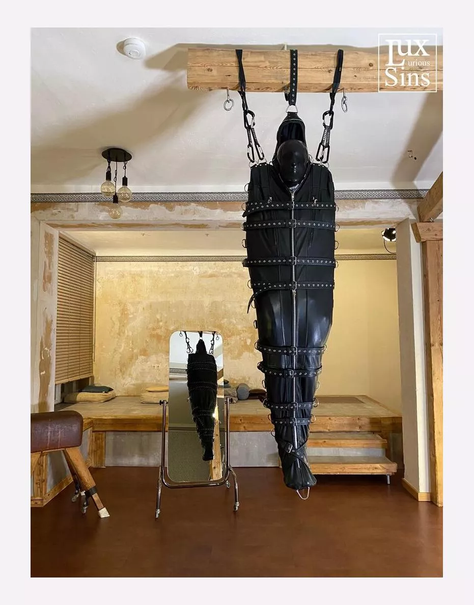 Suspended from tne ceiling in a leather sleepsack posted by No_Target_8122