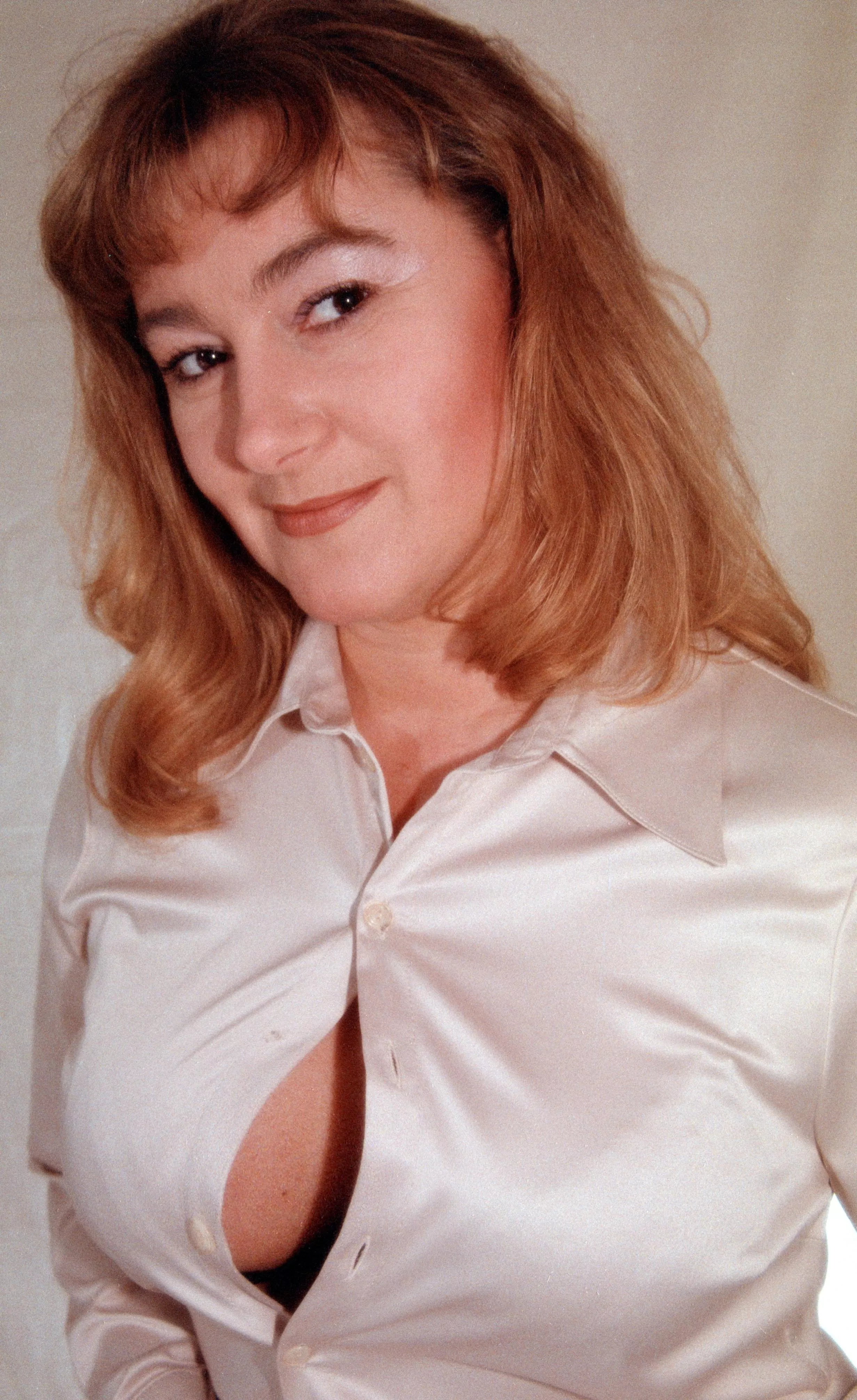 Busty Redhead MILF Secretary Wife Tits have no mercy with the tight Satin Blouse posted by BobbyB008