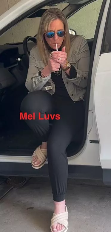 Just a MILF lighting up in her SUV posted by melluvsitall