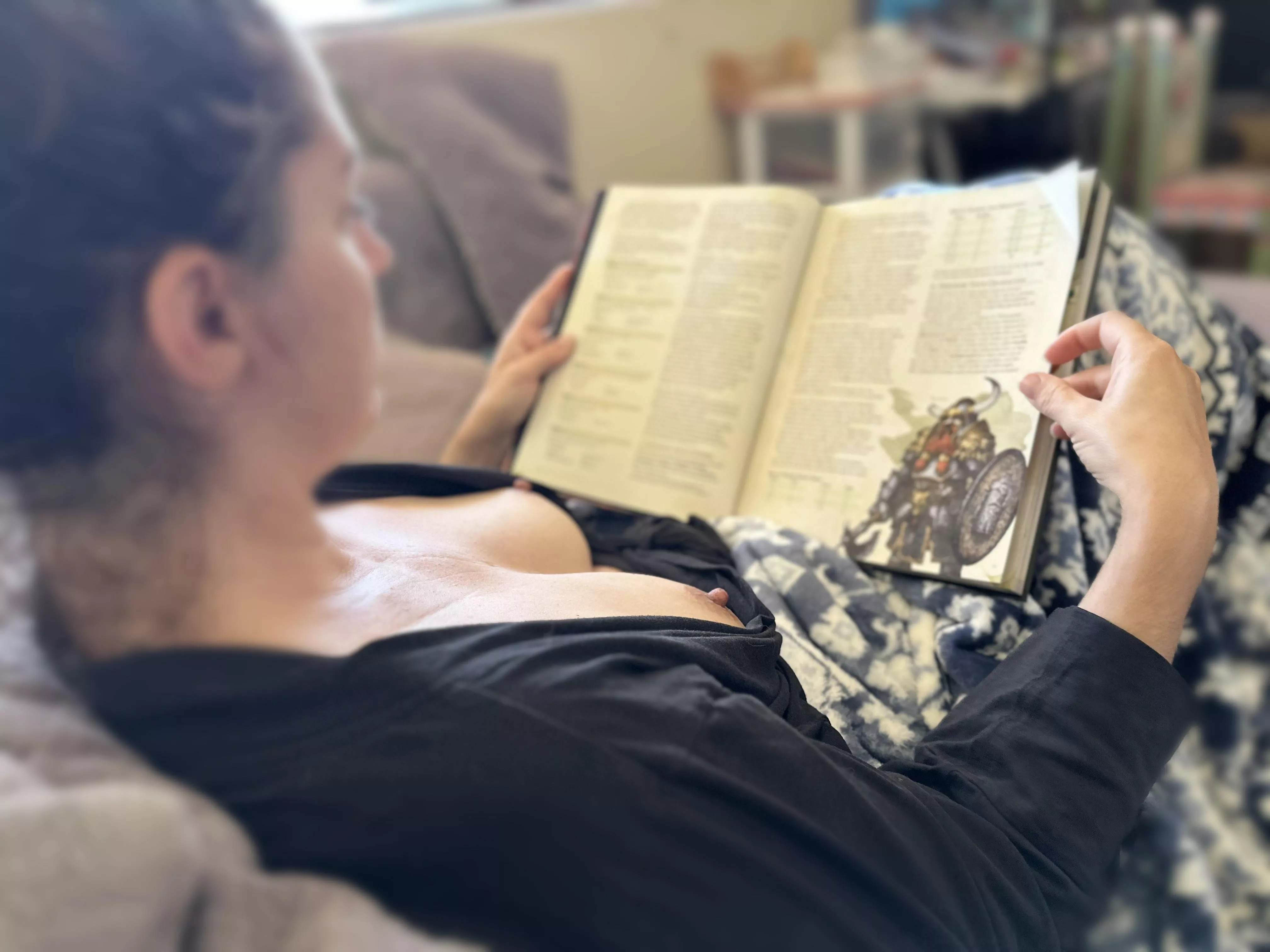 Just a mom reading up on dungeons and dragons with her tits out. You can be sexy and nerdy at the same time right? posted by eve3313