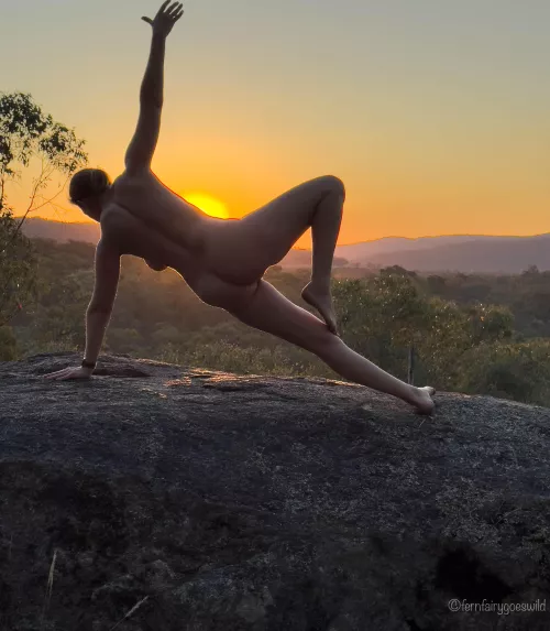 Sunset silhouette nude yoga self portrait on a rock ledge in Australia by Fernfairygoeswild