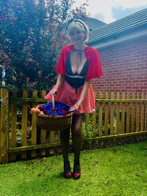 Lauren Red Riding Hood checks she has everything in her basket a Grandma needs, before setting off into the woods! Hehe!  by LAURENSPENCERUK