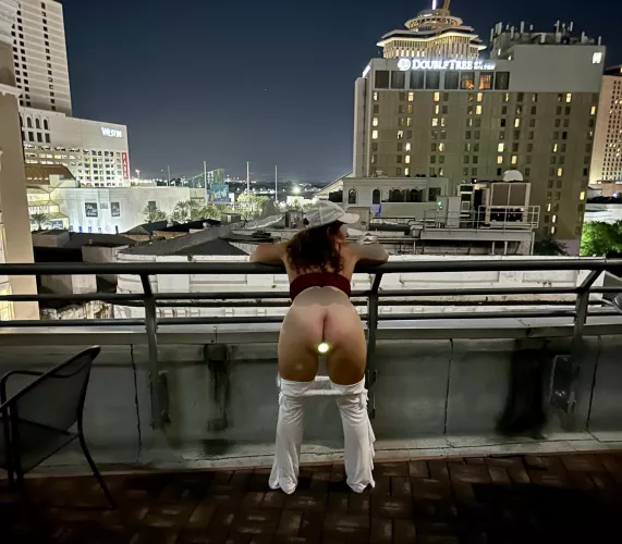 Annie (wife, 55) showing off the light from her LED buttplug on the roof in NOLA. It was a fun night! by AnnieplusMrA