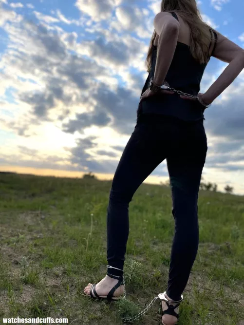 Chained up to enjoy the sunset by JessicaShackled
