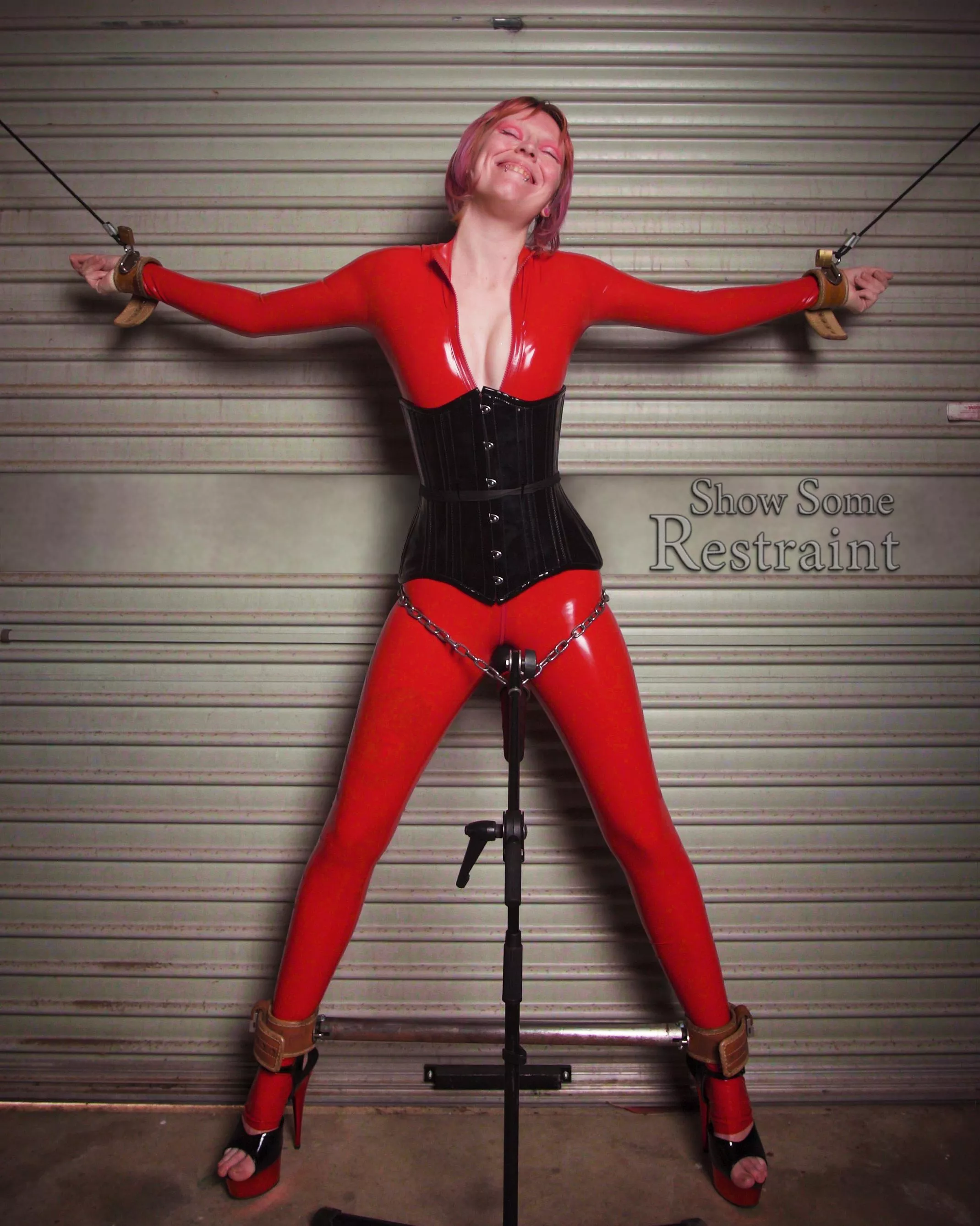 Foxxy spread out in the Humane Restraint cuffs and red latex posted by Show_Some_Restraint