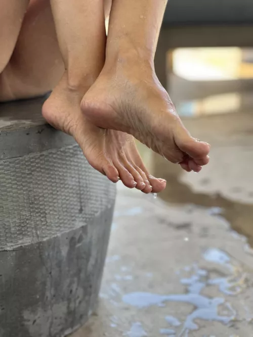 My feet are wet from the water in the pools by albastoes