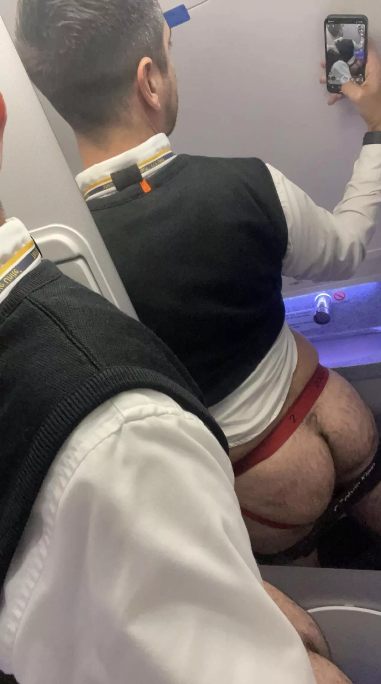 Your flight attendant from behind.  posted by Anontallgay