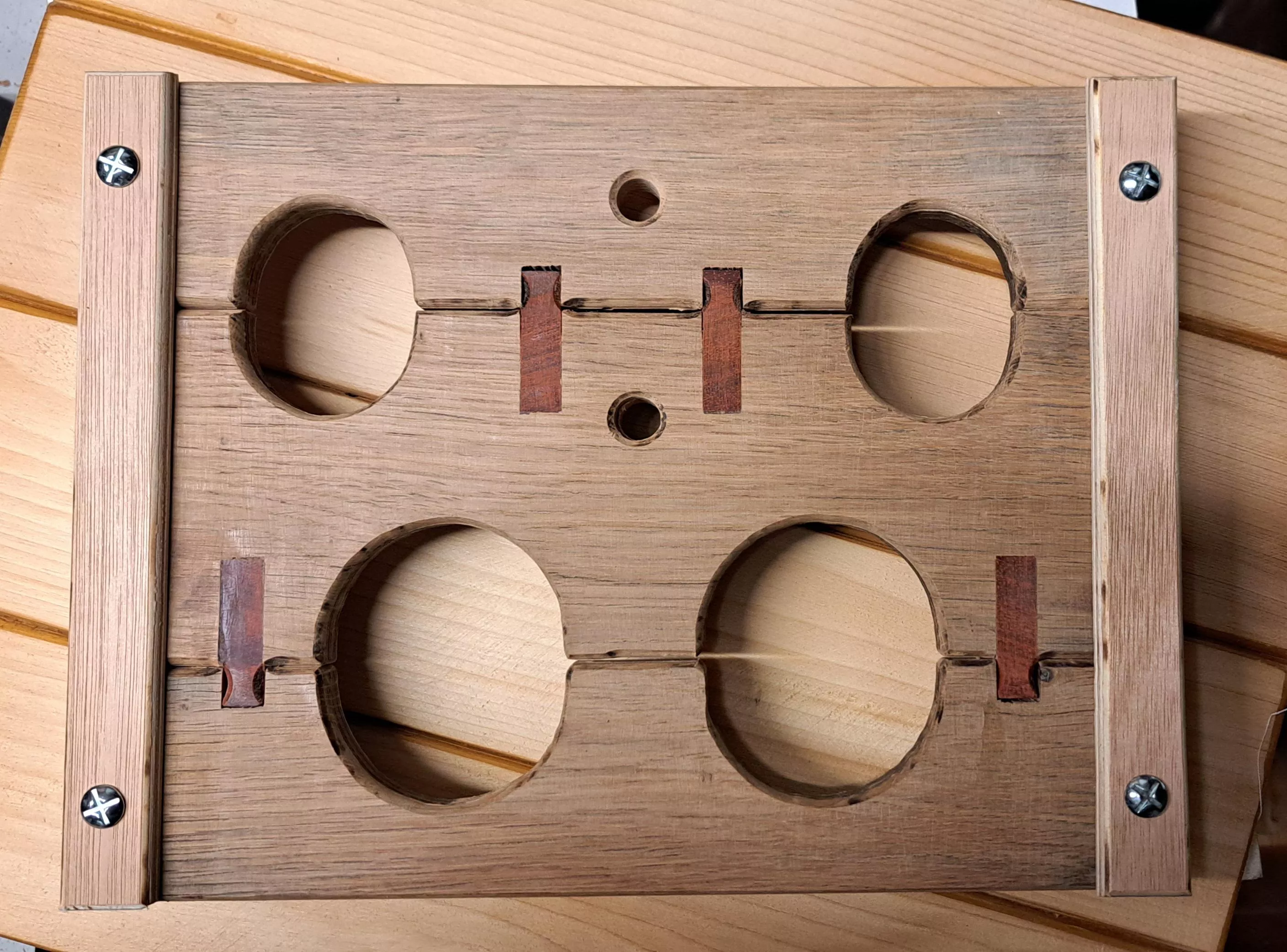 Compact portable 'stocks' - oak padauk - with rope option. posted by Single_Diet7579