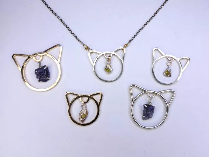making some kitten collars. Sterling Silver and 14k gf and the stones are hand mined here in BC!  by DiggerJer