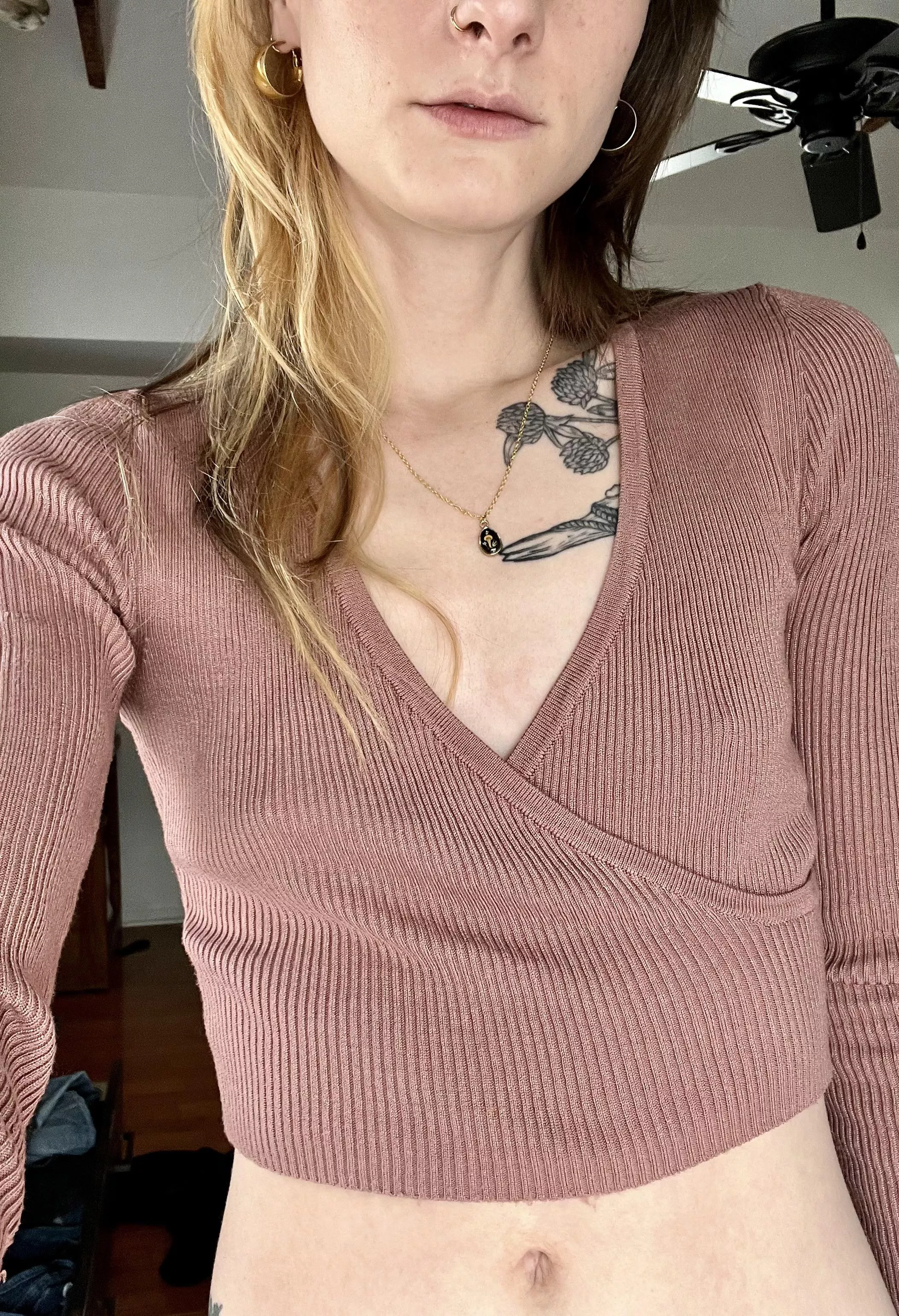 In a cropped sweater posted by stoneyghostkitten