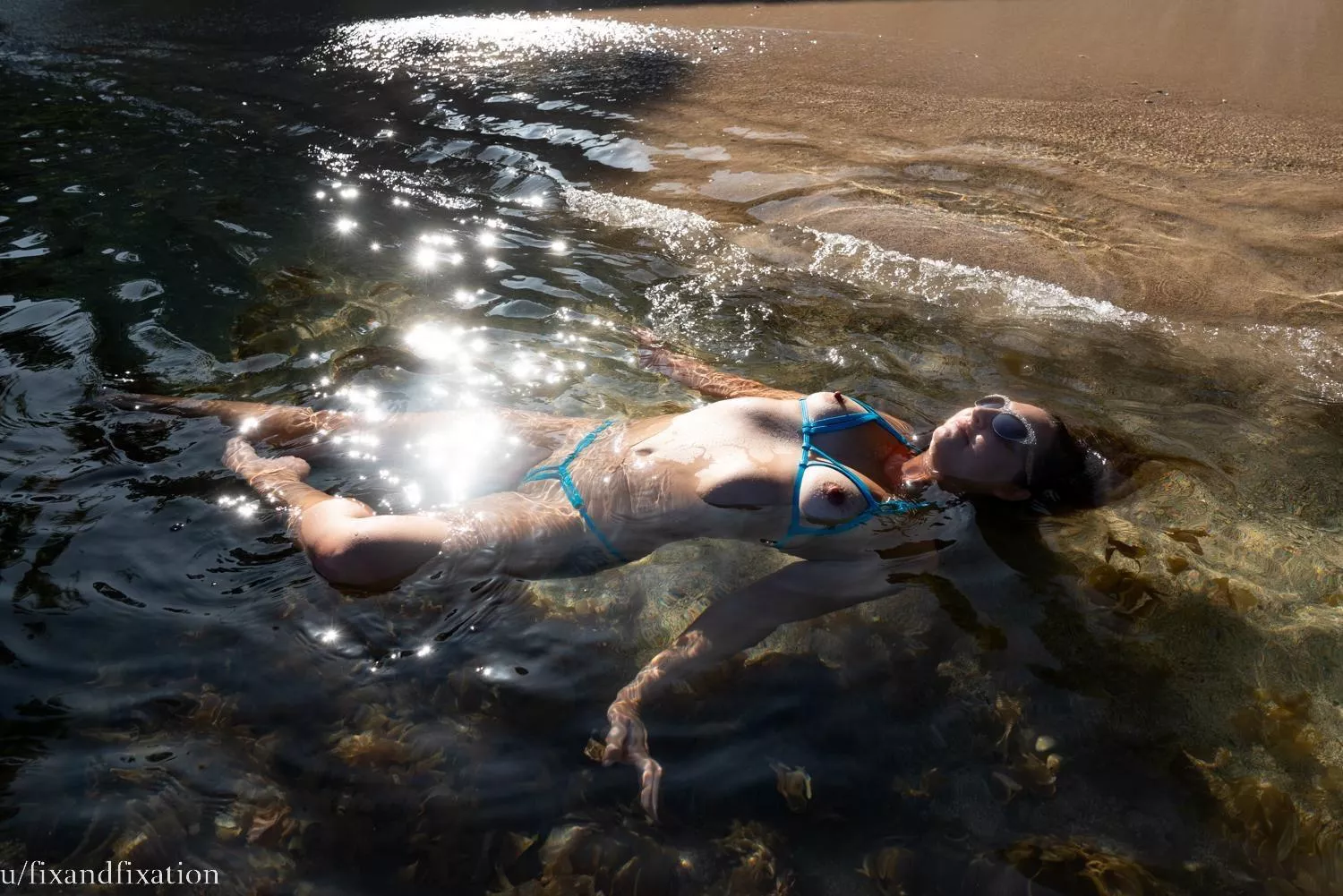 My wife u/fixandfixation floating in paradise wearing a barely there bikini posted by dim-my-eyes