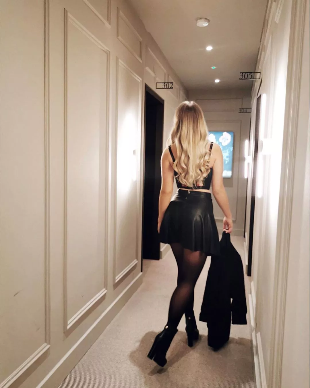 In the hotel corridor posted by DesignerJaded5231