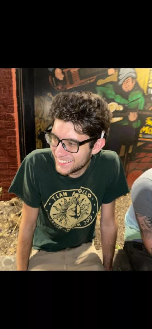 Old candid photo. I don’t wear glasses anymore but they were the vibe for awhile. by TitleSalty6489