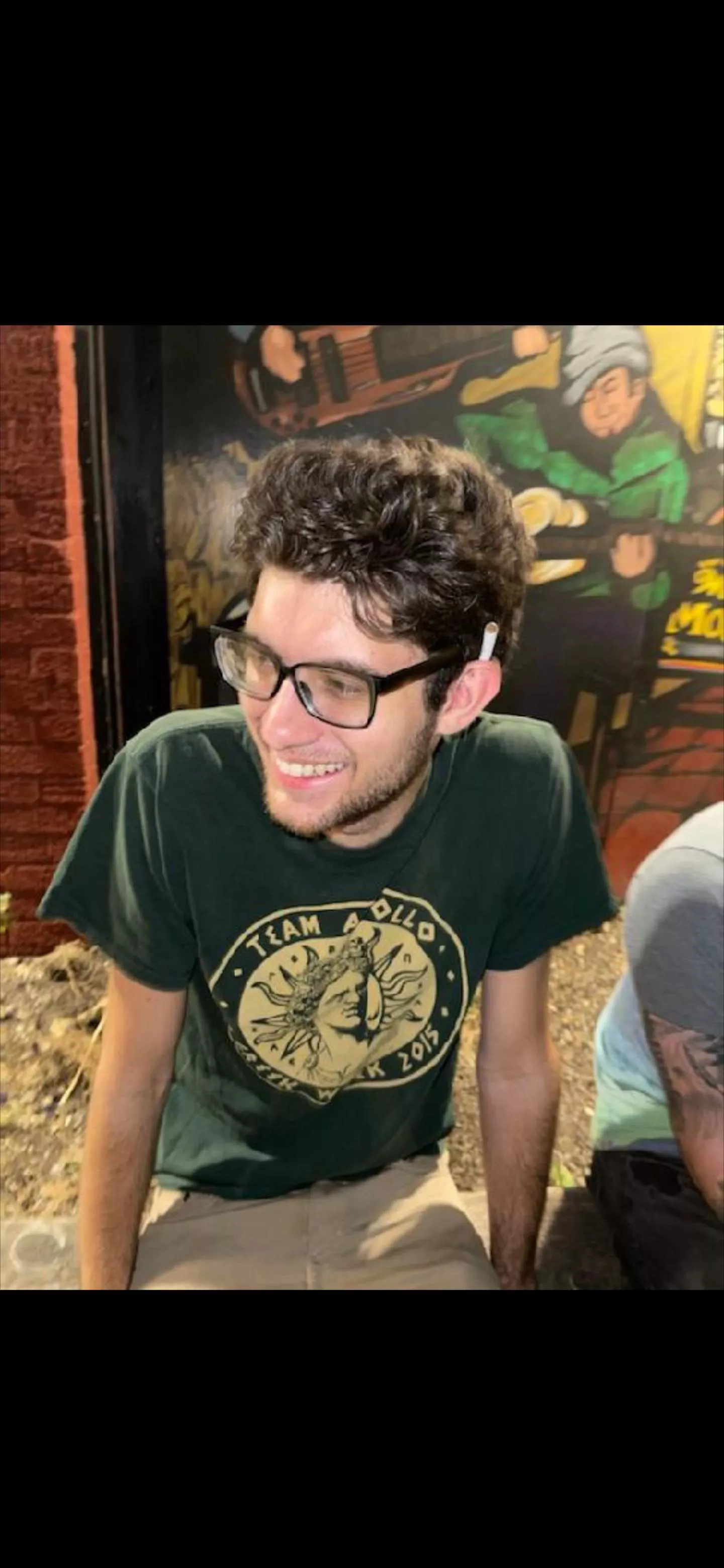 Old candid photo. I don’t wear glasses anymore but they were the vibe for awhile. posted by TitleSalty6489