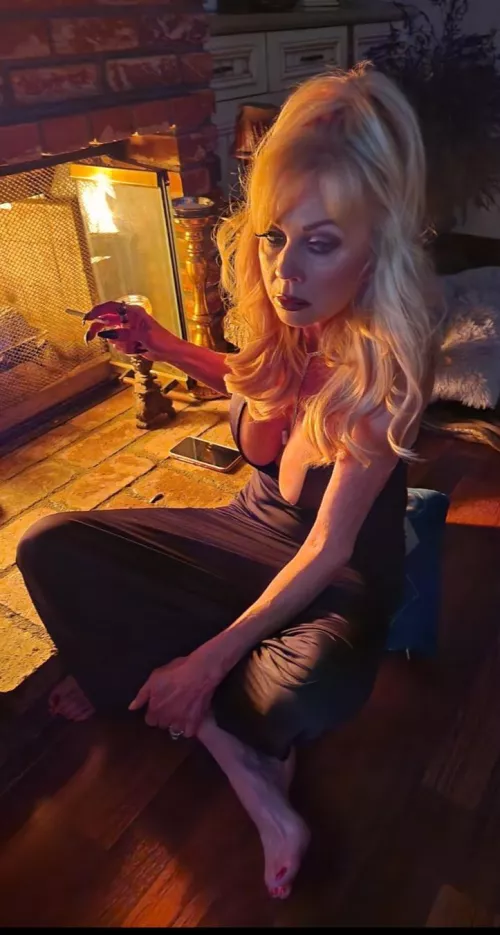 Glass of wine and a smoke by the 🔥 by SongLopsided4065