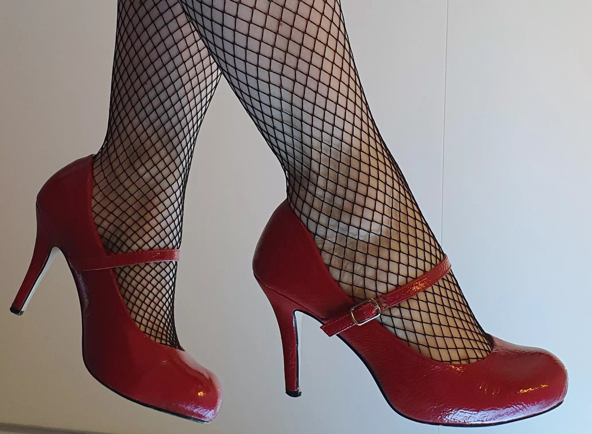 Red heels & Fishnets 😊 posted by heelssolestoes