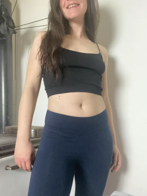 Smiling and looking cute while warming my butt on the stove by Thesquitties