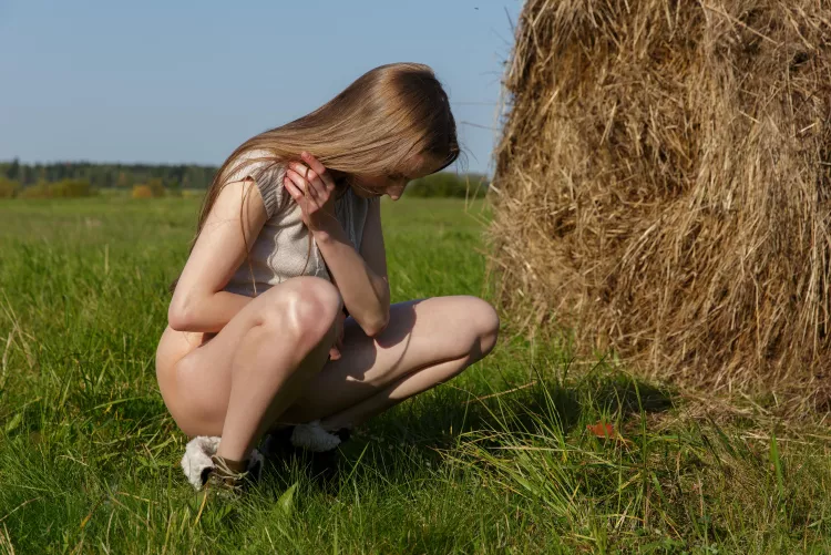 pissing in the grass by famegirls