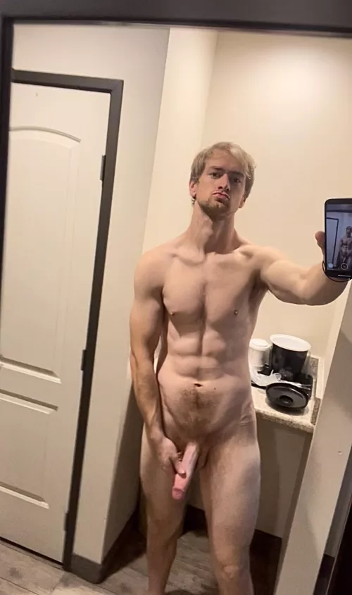 Man looks at man in the mirror by essential2life