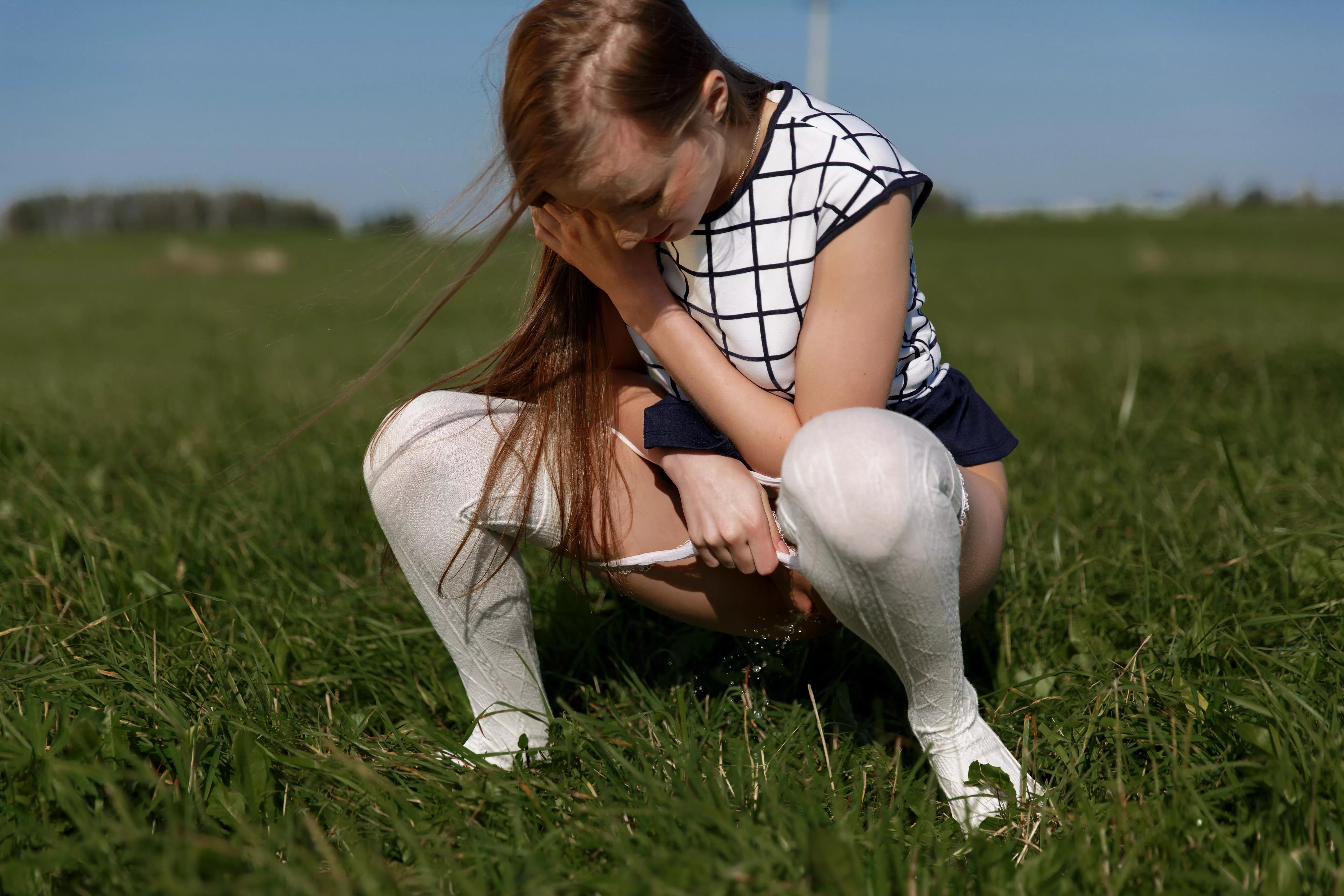 pissing on the field with her panties down posted by famegirls