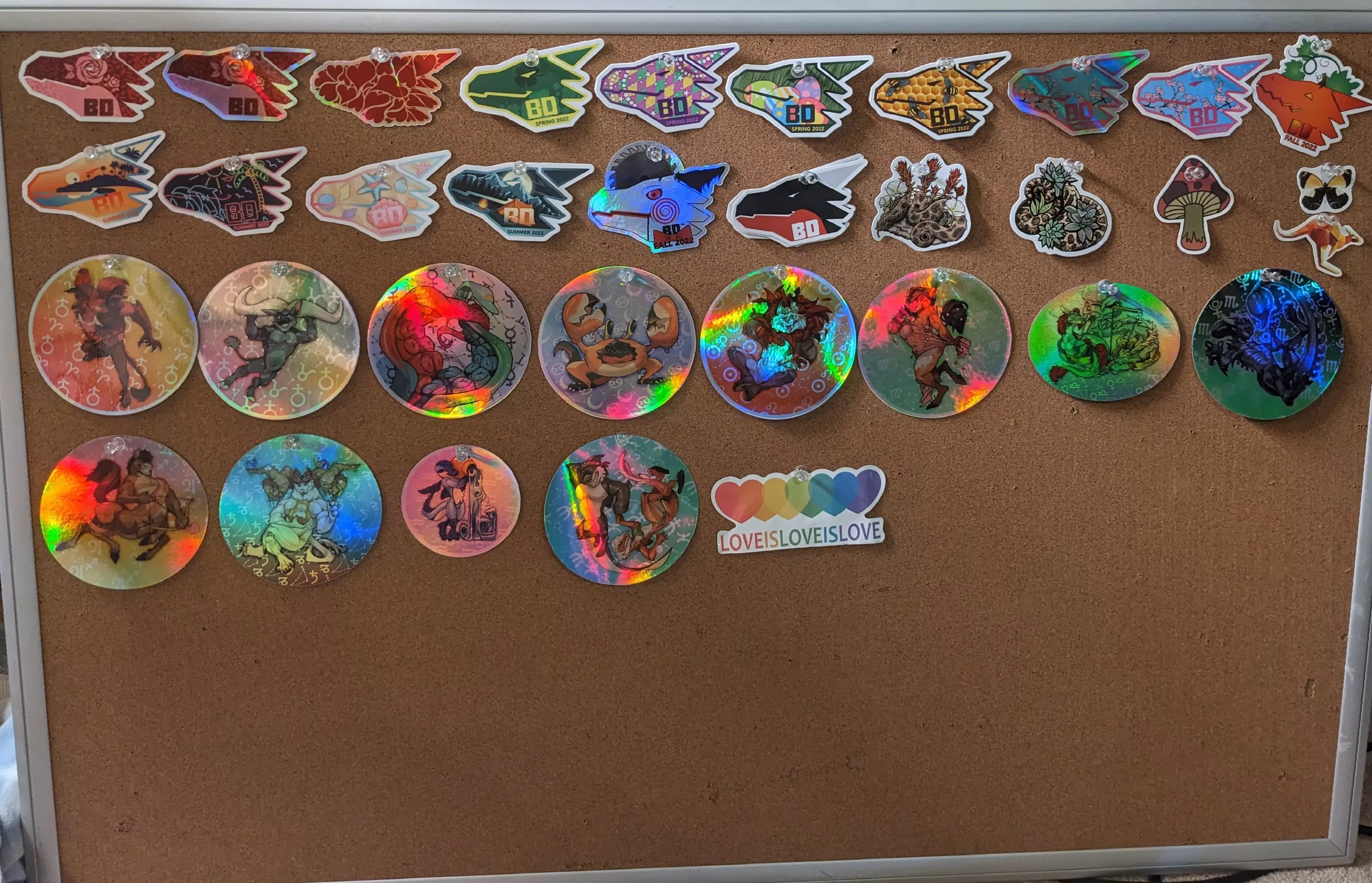 don't like sticking stickers so I pin them. Just got a nice board for them at the thrift store so I have space to display all of them :3. posted by YourFavoritestMe