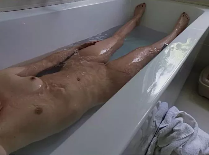 Relaxing and washing off the stable smells!! by NakedCountryGirl